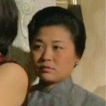 Wang Dan as Jiang Feng's dresser, Madam Yang