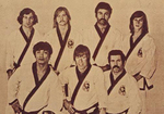 Back row top (left to right): V. Moogen, B. Burbege, Darnell Garcia and T. Updike,
Front row (left to right): J. Natividad , Chuck Norris and Pat E. Johnson