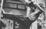 behind the scenes of ENTER THE DRAGON: Bruce Lee kicking a dummy for Sek Kin